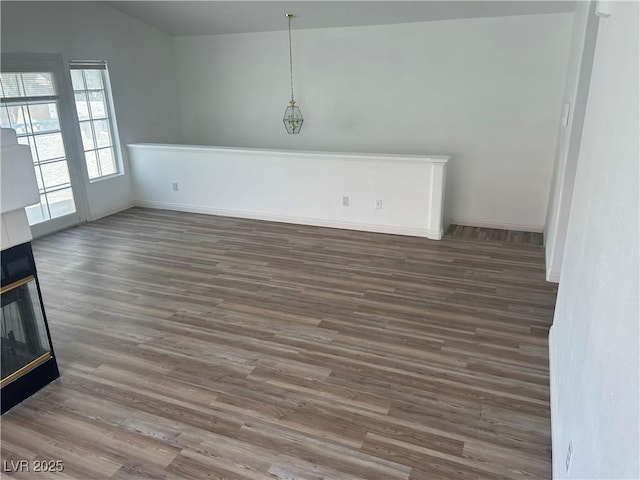 5201 S Torrey Pines Dr Unit 1184, Las Vegas, NV 89118 - unfurnished dining area featuring wood finished floors and vaulted ceiling