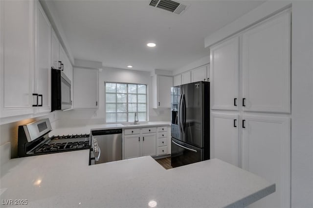 5201 S Torrey Pines Dr Unit 1184, Las Vegas, NV 89118 - kitchen featuring appliances with stainless steel finishes, recessed lighting, and white cabinetry