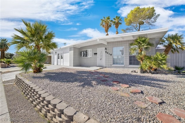 3616 Chevy Chase Ave, Las Vegas, NV 89110 - rear view of property featuring driveway and concrete block siding