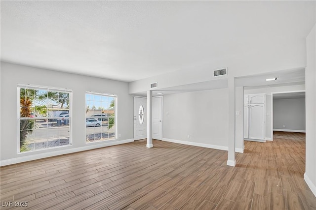 3616 Chevy Chase Ave, Las Vegas, NV 89110 - unfurnished living room featuring wood finished floors and baseboards