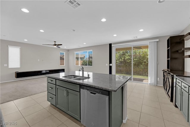 8969 Rice Peak St, Las Vegas, NV 89148 - kitchen featuring dishwasher, dark stone countertops, light tile patterned flooring, healthy amount of natural light, and recessed lighting