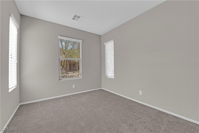 8969 Rice Peak St, Las Vegas, NV 89148 - spare room with plenty of natural light and carpet