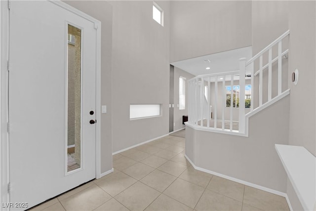 8969 Rice Peak St, Las Vegas, NV 89148 - entrance foyer featuring light tile patterned floors and stairway