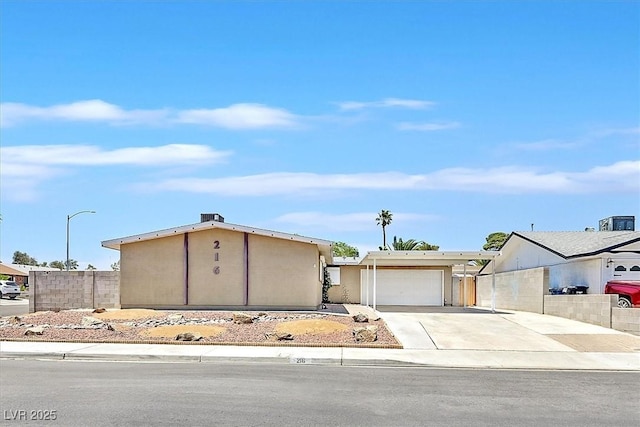 216 Lorenzi St, Las Vegas, NV 89107 - view of front of home with driveway and an attached garage