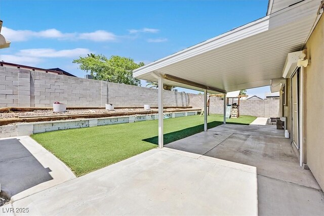 216 Lorenzi St, Las Vegas, NV 89107 - fenced backyard with a patio area