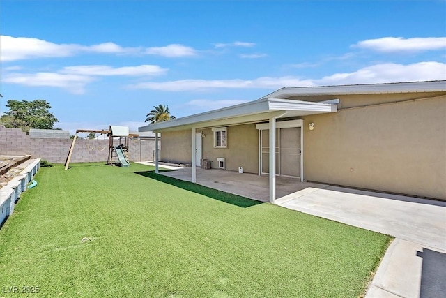 216 Lorenzi St, Las Vegas, NV 89107 - view of yard with a patio area and a playground