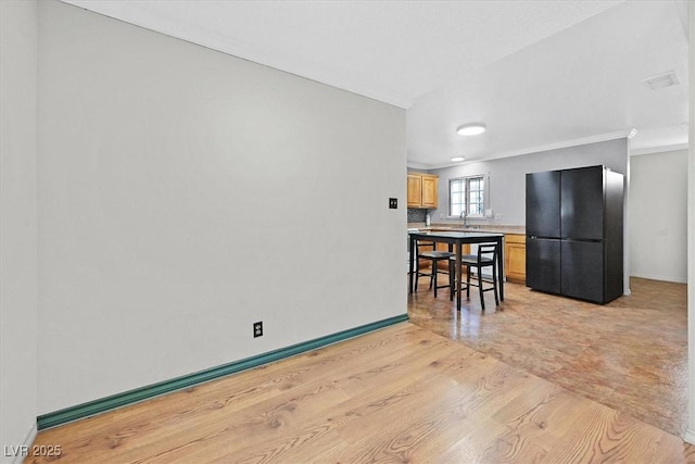 216 Lorenzi St, Las Vegas, NV 89107 - dining area with ornamental molding and light wood-type flooring