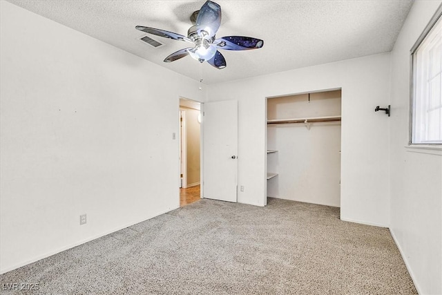 216 Lorenzi St, Las Vegas, NV 89107 - unfurnished bedroom with carpet flooring, a textured ceiling, a ceiling fan, and a closet