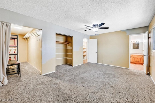 216 Lorenzi St, Las Vegas, NV 89107 - unfurnished bedroom with carpet floors, a closet, a textured ceiling, a ceiling fan, and ensuite bathroom