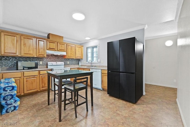 216 Lorenzi St, Las Vegas, NV 89107 - kitchen with white appliances, under cabinet range hood, ornamental molding, decorative backsplash, and light countertops