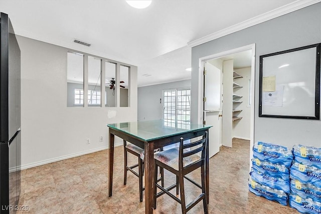 216 Lorenzi St, Las Vegas, NV 89107 - dining area with crown molding and a ceiling fan
