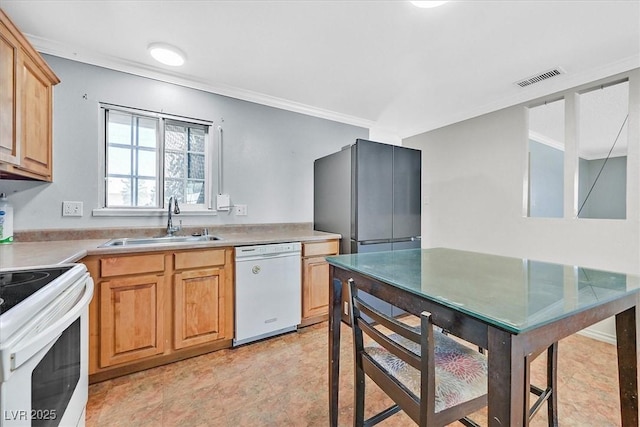 216 Lorenzi St, Las Vegas, NV 89107 - kitchen featuring white appliances, crown molding, and light countertops
