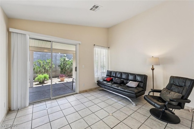9362 Baltinglass St, Las Vegas, NV 89123 - living area featuring light tile patterned floors and vaulted ceiling
