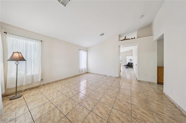 9362 Baltinglass St, Las Vegas, NV 89123 - unfurnished room featuring vaulted ceiling and light tile patterned floors