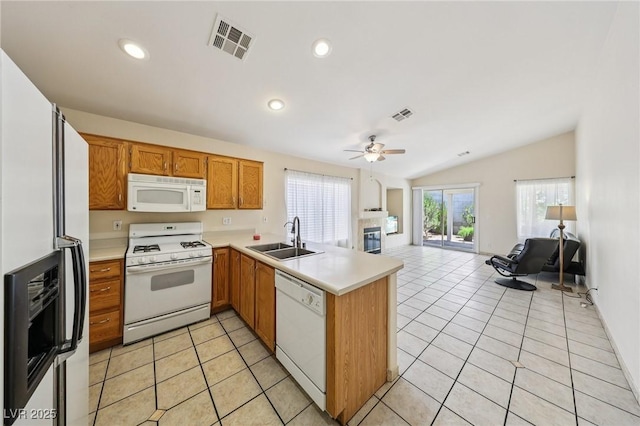 9362 Baltinglass St, Las Vegas, NV 89123 - kitchen featuring white appliances, a peninsula, open floor plan, a ceiling fan, and light countertops