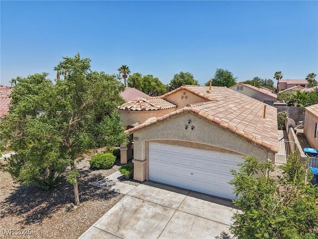9362 Baltinglass St, Las Vegas, NV 89123 - mediterranean / spanish house with a tile roof, driveway, stucco siding, and a garage