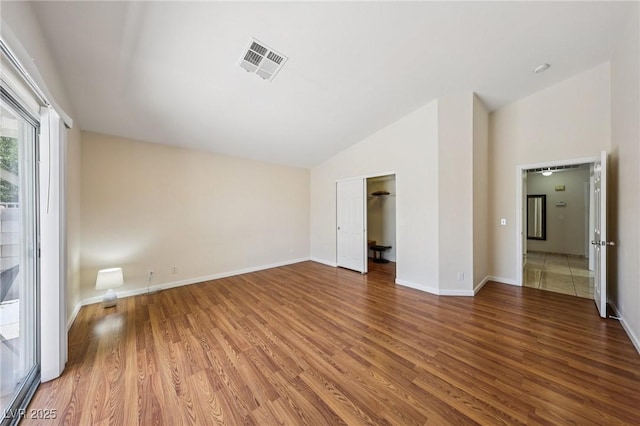 9362 Baltinglass St, Las Vegas, NV 89123 - unfurnished room featuring wood finished floors and high vaulted ceiling