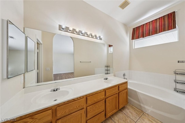 9362 Baltinglass St, Las Vegas, NV 89123 - full bath featuring a garden tub, double vanity, and tile patterned flooring