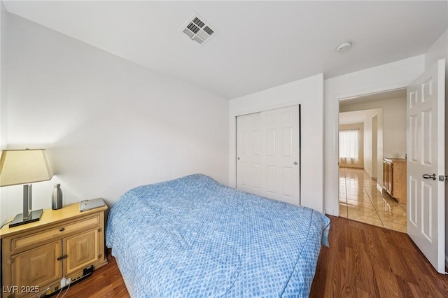 9362 Baltinglass St, Las Vegas, NV 89123 - bedroom featuring dark wood-style floors and a closet