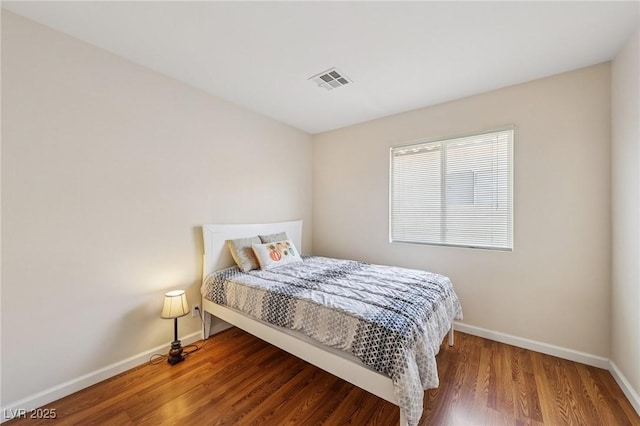 9362 Baltinglass St, Las Vegas, NV 89123 - bedroom with baseboards and wood finished floors