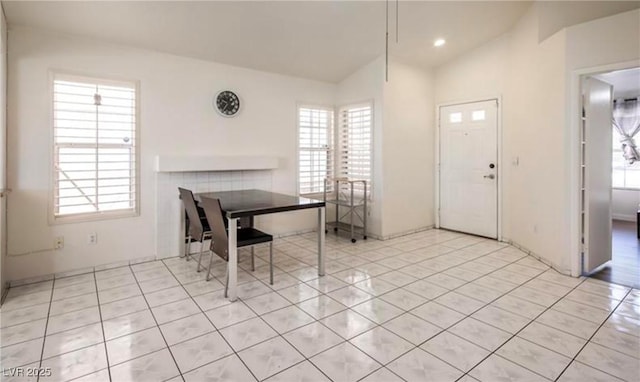 4466 New Dupell Way, Las Vegas, NV 89147 - dining space with healthy amount of natural light, light tile patterned floors, and vaulted ceiling