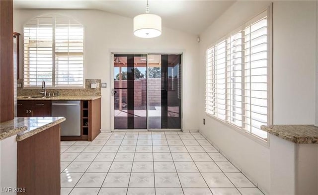 4466 New Dupell Way, Las Vegas, NV 89147 - unfurnished dining area featuring lofted ceiling and light tile patterned floors