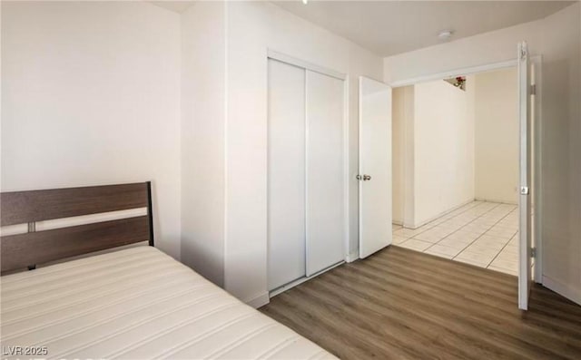 4466 New Dupell Way, Las Vegas, NV 89147 - unfurnished bedroom featuring wood finished floors and a closet