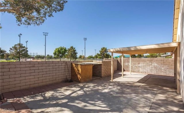 4466 New Dupell Way, Las Vegas, NV 89147 - fenced backyard featuring a patio area