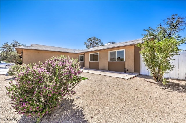 3887 Delling Ct, Las Vegas, NV 89104 - back of property with stucco siding and a patio