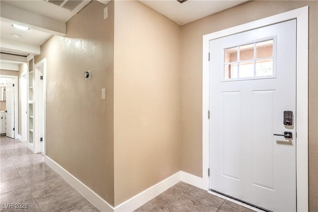 3887 Delling Ct, Las Vegas, NV 89104 - entryway featuring baseboards and light tile patterned floors