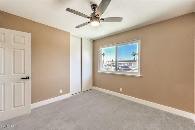 3887 Delling Ct, Las Vegas, NV 89104 - unfurnished bedroom with light colored carpet, a closet, and a ceiling fan