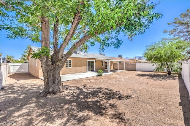 3887 Delling Ct, Las Vegas, NV 89104 - rear view of property with a patio, stucco siding, a fenced backyard, and french doors