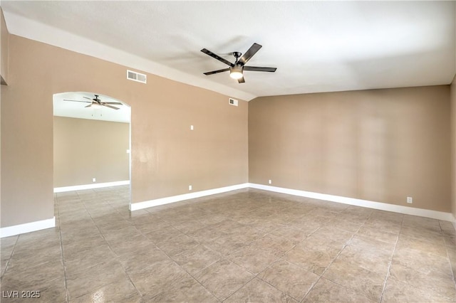 3887 Delling Ct, Las Vegas, NV 89104 - tiled empty room featuring ceiling fan and arched walkways