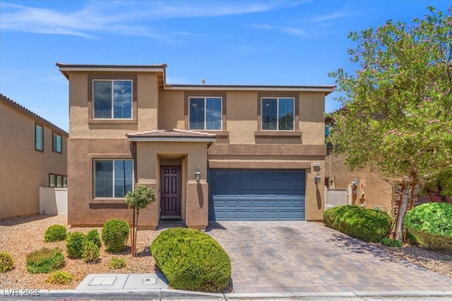 5309 Golden Melody Ln, North Las Vegas, NV 89081 - view of front of property featuring stucco siding, a garage, and decorative driveway