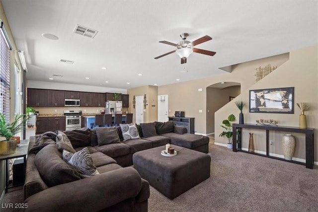 5309 Golden Melody Ln, North Las Vegas, NV 89081 - living room featuring arched walkways, ceiling fan, carpet floors, and recessed lighting