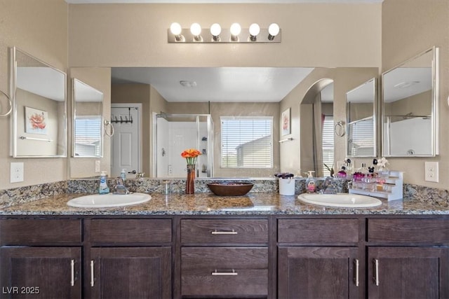 5309 Golden Melody Ln, North Las Vegas, NV 89081 - full bathroom with a stall shower and double vanity