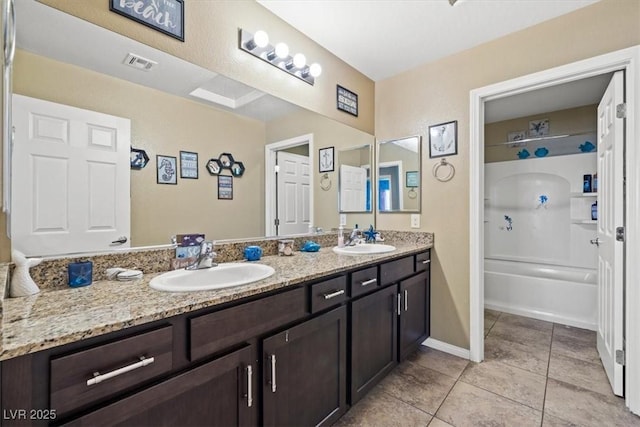 5309 Golden Melody Ln, North Las Vegas, NV 89081 - full bath with double vanity, tile patterned floors, and shower / tub combination