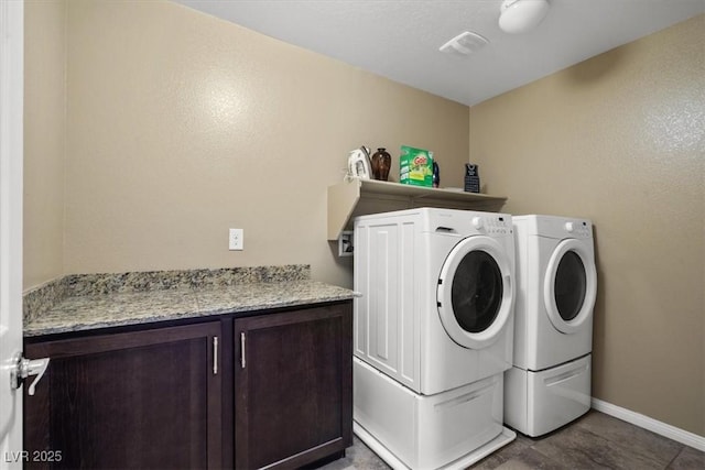 5309 Golden Melody Ln, North Las Vegas, NV 89081 - laundry room featuring separate washer and dryer and cabinet space