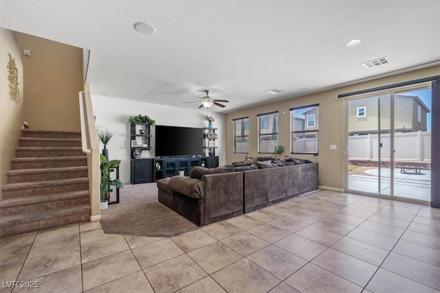 5309 Golden Melody Ln, North Las Vegas, NV 89081 - living room with light tile patterned flooring, stairway, and a ceiling fan