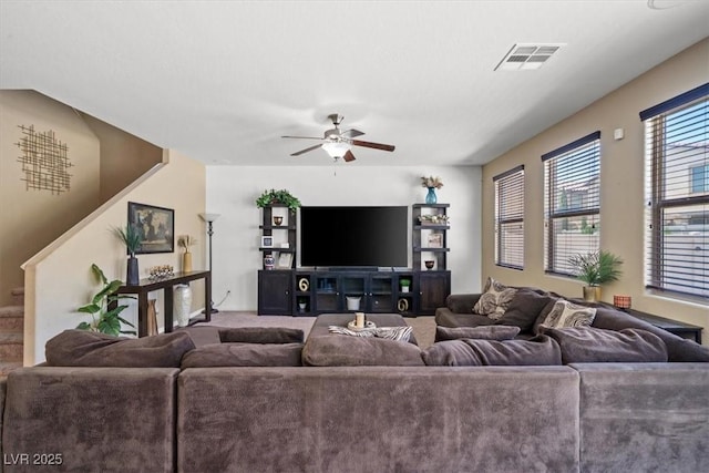 5309 Golden Melody Ln, North Las Vegas, NV 89081 - living room with ceiling fan, carpet floors, and stairs