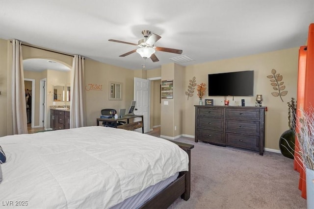 5309 Golden Melody Ln, North Las Vegas, NV 89081 - bedroom with arched walkways, carpet, and a ceiling fan