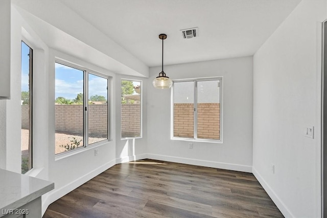 2820 Golf Links Dr, Las Vegas, NV 89134 - unfurnished dining area with dark wood finished floors and baseboards