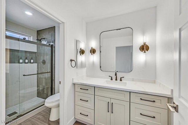 2820 Golf Links Dr, Las Vegas, NV 89134 - bathroom featuring vanity, a shower stall, and wood finished floors