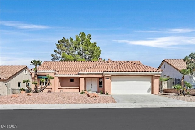 2820 Golf Links Dr, Las Vegas, NV 89134 - view of front of house with an attached garage, a tile roof, concrete driveway, stucco siding, and a gate