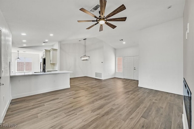 2820 Golf Links Dr, Las Vegas, NV 89134 - unfurnished living room featuring wood finished floors, ceiling fan, recessed lighting, and lofted ceiling
