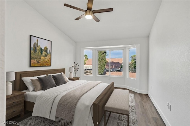 2820 Golf Links Dr, Las Vegas, NV 89134 - bedroom with vaulted ceiling, wood finished floors, and a ceiling fan