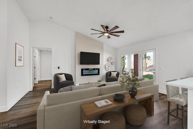 2820 Golf Links Dr, Las Vegas, NV 89134 - living room with lofted ceiling, dark wood-style flooring, ceiling fan, and a glass covered fireplace