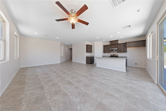 3912 Makushin Bay Ave, North Las Vegas, NV 89081 - unfurnished living room with ceiling fan and recessed lighting