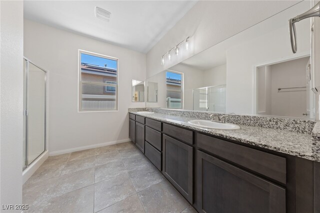 3912 Makushin Bay Ave, North Las Vegas, NV 89081 - full bath featuring a stall shower and double vanity