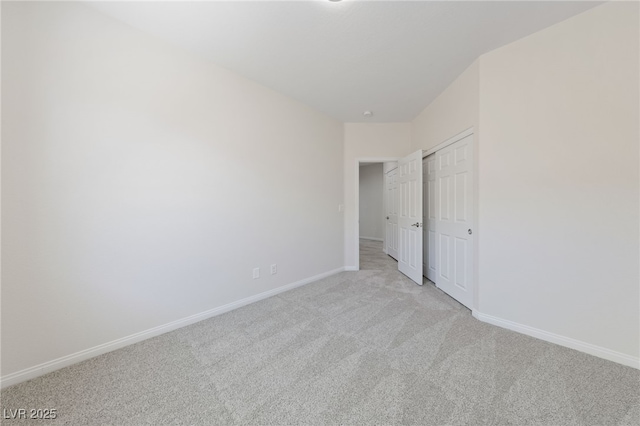 3912 Makushin Bay Ave, North Las Vegas, NV 89081 - unfurnished bedroom featuring light colored carpet and a closet